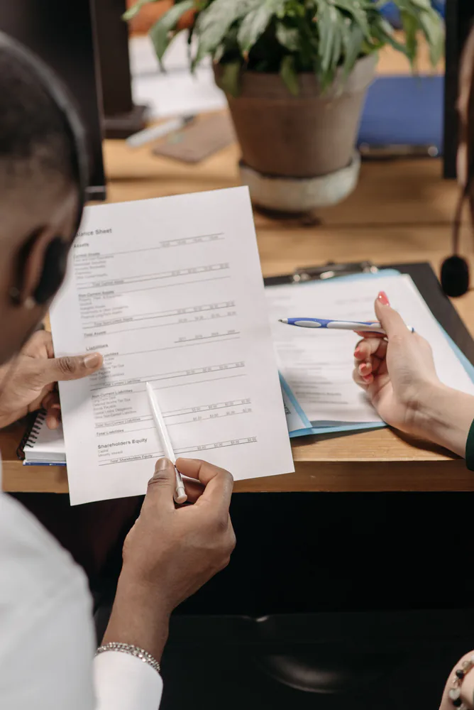 Financial records being reviewed at the start of an assignment
