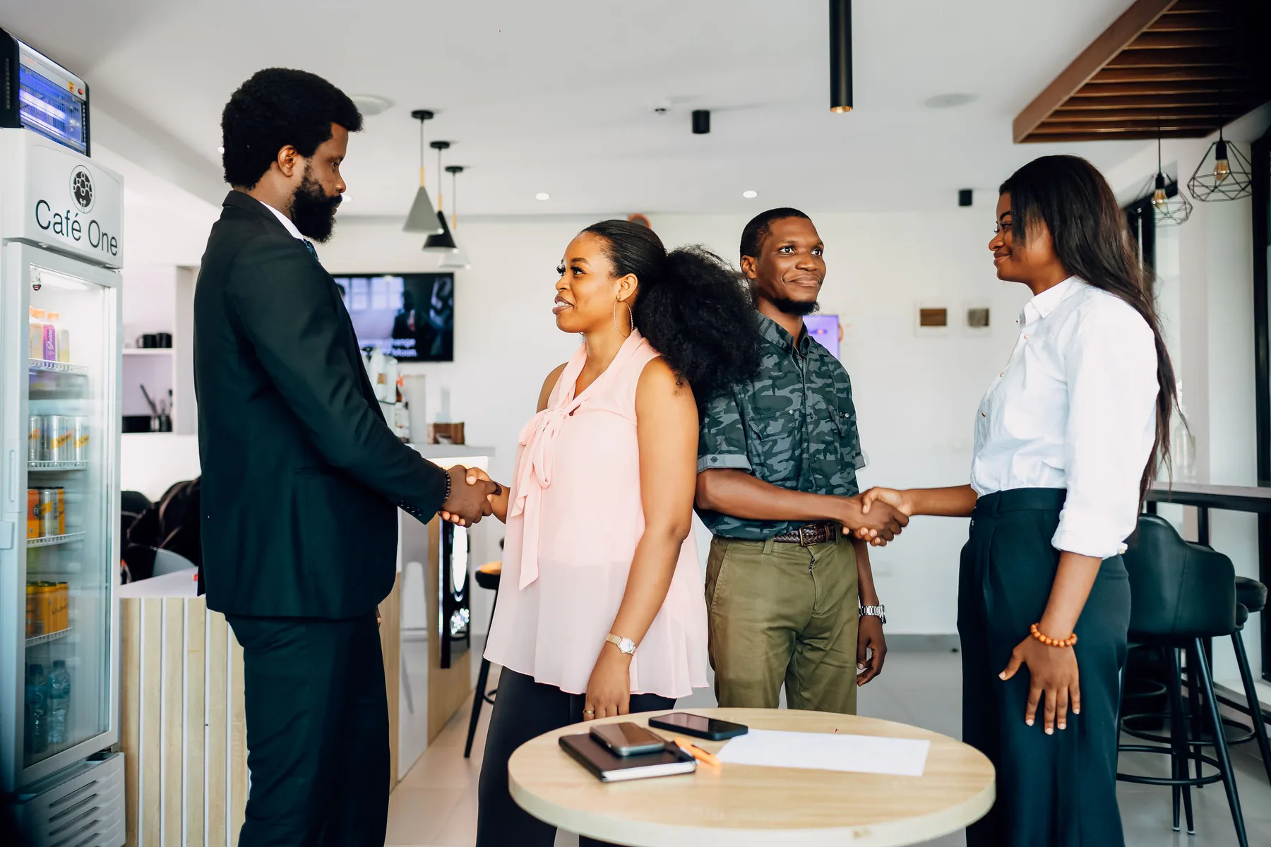 Lagos professionals confirming a business partnership with a handshake